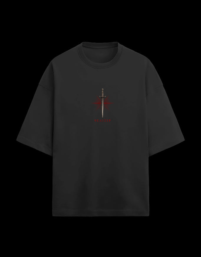 9ELIXIR Nemesis oversized tee in black — dagger and starburst chest crest, front view